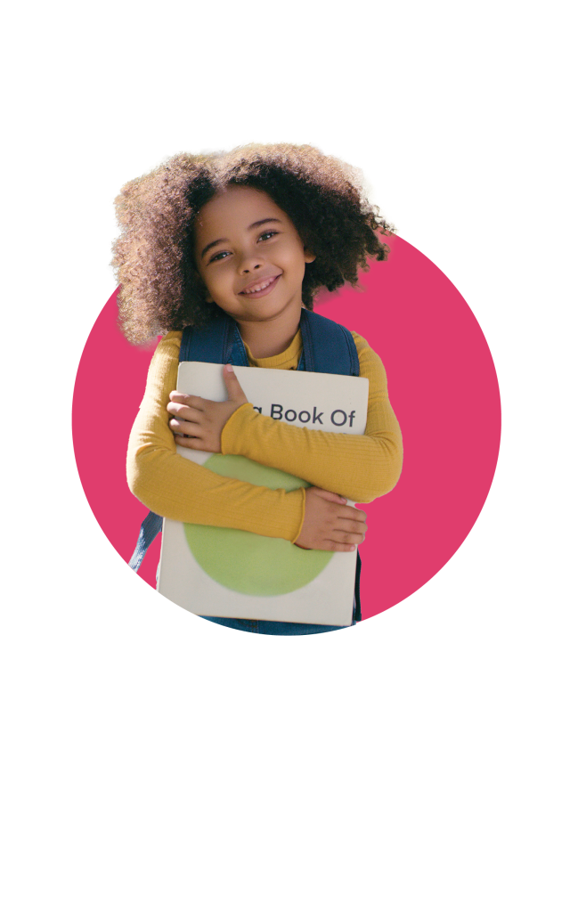 small girl holding a book