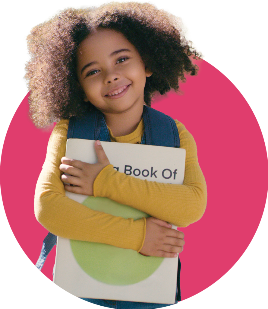 small girl holding a book
